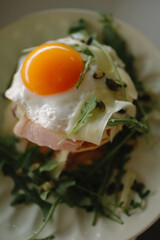 fried egg with bacon and vegetables