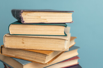 Stack of old books on the blue background. World Book Day poster