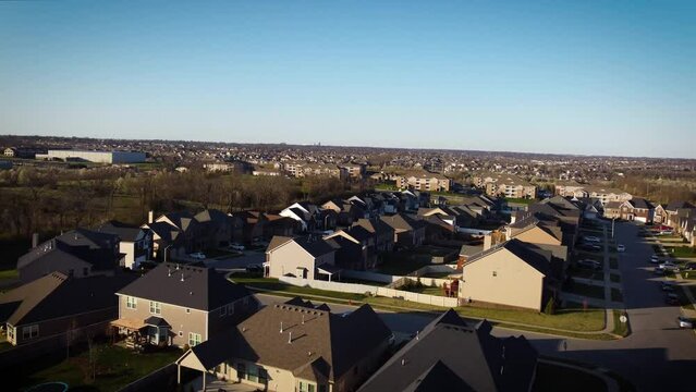 Drone Flying Above Newly Built Houses In Expanding Neighborhood Of Lexington, Kentucky Towards Business Financial District Downtown Area