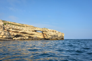 Fototapeta na wymiar rocky shore of Black Sea, landscape with rocks on seashore, rocks sticking out of sea