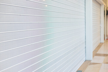 Obraz premium Stores show case in shopping mall closed due to sanctions, boycott and embargo, mass market cloth shops work stoppage with closed storefronts, retail business suspension and brands leaving market