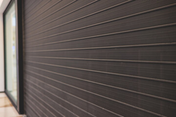 Obraz premium Stores show case in shopping mall closed due to sanctions, boycott and embargo, mass market cloth shops work stoppage with closed storefronts, retail business suspension and brands leaving market