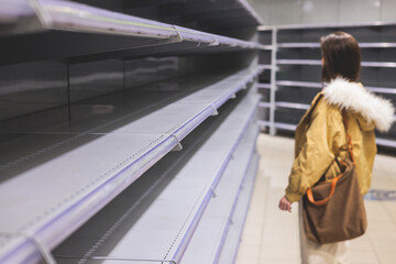View of empty supermarket shelves, grocery store work stoppage closes, sanctions and embargo, panic...