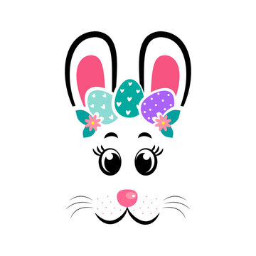 The face of the Easter bunny with a wreath of eggs on white isolated background
