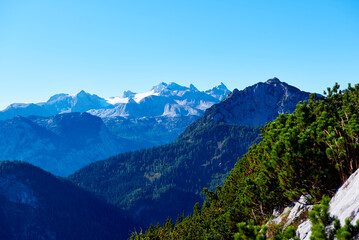Naklejka na ściany i meble Beautiful Foggy Landscape in Austrian Alps with top mountains.