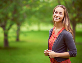 Look for the beauty in every day. Portrait of a young woman standing in the outdoors.