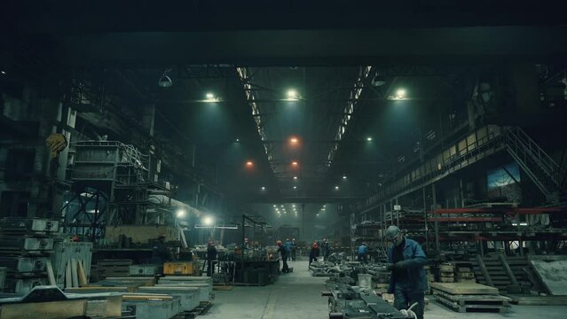Metallurgical plant workshop interior with metal molts and workers. heavy industry, metal or iron manufacturing.