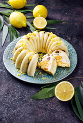 Traditional Italian budino di ricotta cheese pudding cake with raisins and lemon creme served as close-up on a design plate with cottage style decoration