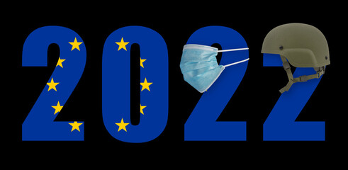 2022 in a mask from a covid and in a helmet with the flag of the European Union