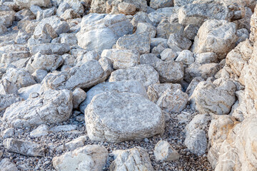 White rocks on the coast . Big stones on the seaside 