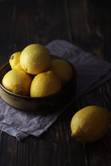 A bowl with yellow bright lemons