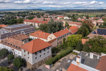 Fototapeta na wymiar Aerial view of Szecseny in Nograd county Hungary with walled medieval center, modern block houses typical Hungarian small town