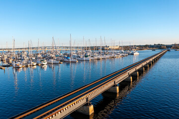 Fototapeta na wymiar Aerial View of a railroad Bridge and a marina in New Bern North Carolina
