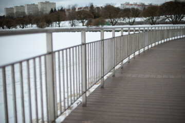 Details of promenade in winter. Urban architecture. Street on winter day.