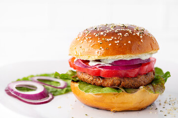 Healthy  veggie burger on a brioche bun with copy space