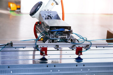 Robotic arm taking metal sheet