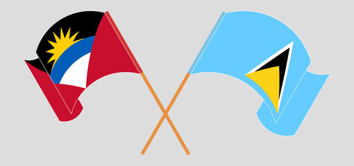 Crossed and waving flags of Antigua and Barbuda and Saint Lucia