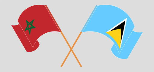 Crossed and waving flags of Morocco and Saint Lucia