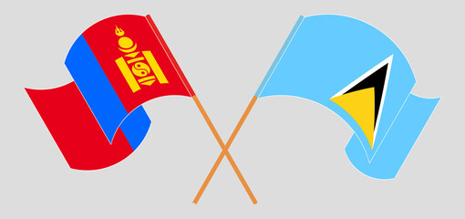 Crossed and waving flags of Mongolia and Saint Lucia
