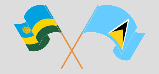 Crossed and waving flags of Rwanda and Saint Lucia