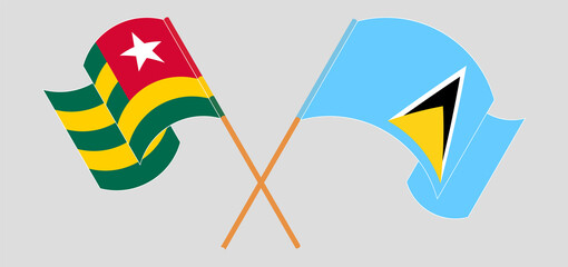 Crossed and waving flags of Togo and Saint Lucia