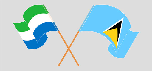 Crossed and waving flags of Sierra Leone and Saint Lucia