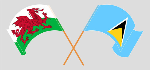 Crossed and waving flags of Wales and Saint Lucia
