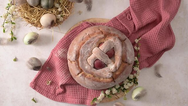 Easter folar with egg on wooden table top.