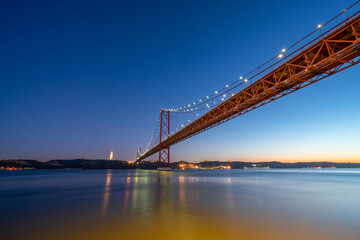 The 25 de Abril bridge over the Tajo River Lisbon. Portugal