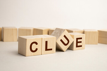 Man made word CLUES with wood blocks