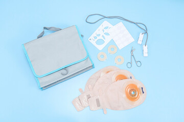 A patient set of colostomy bag on a gentle blue background.