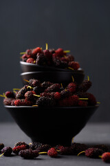 Mulberry fruit from local market on black background, Tropical fruit in spring and summer season