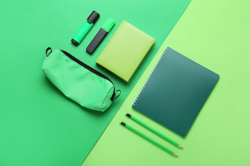 Set of stationery on green background