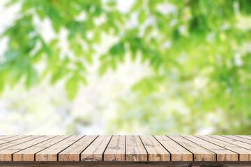 Empty wooden table with blurred green background with a country outdoor theme,Template mock up for display of product