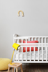 Modern children's room with comfortable crib