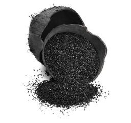Coconut shells with activated carbon on white background