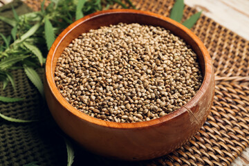 Bowl with hemp seeds on table