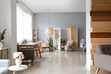 Interior of big room with stylish furniture and mirror