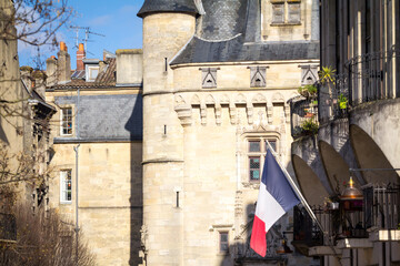 Typical panorama of a narrow street of bordeaux city center, in france, with the Porte Cailhau, a...