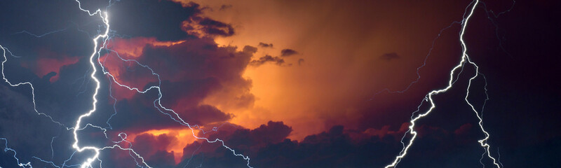 Fork lightning striking down during summer storm	