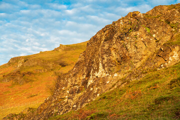 Fototapeta premium Looking west over the nearby Long Mynd,at sunrise,from Caer Caradoc,Shropshire,England,United Kingdom.