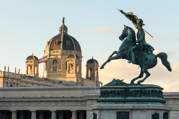 Obraz premium Archduke Charles equestrian monument on Heldenplatz square and Museum of Natural History dome in Vienna, Austria