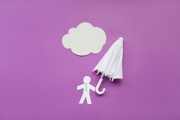 Composition with umbrella, paper human figure and cloud on color background