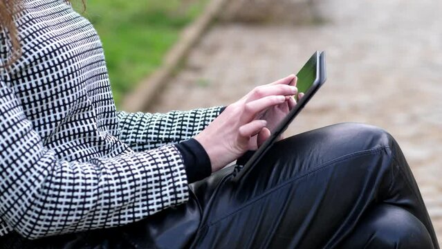 Close up of  woman hands using tablet. Woman hand using tablet to do business