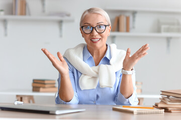 Female tutor giving lesson at home