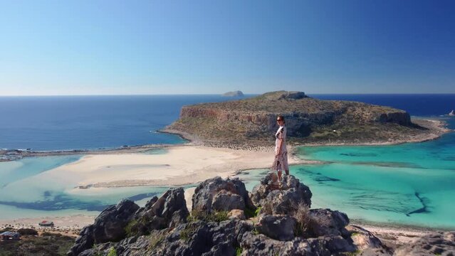 Woman observing balos empty Balos beach, Crete, Greece.