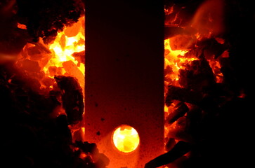Vertically located iron product on burning coal.