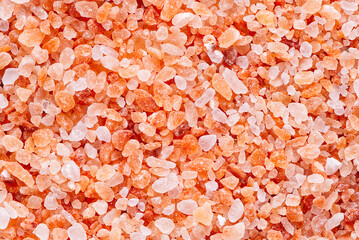 Fototapeta na wymiar Indus himalayan pink salt abstract background. Himalayan Pink rock Salt.