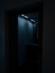 shot at night of a elevator open doors in a empty floor, night, interior, dark