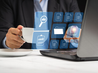 Businessman reading digital documents on a virtual screen